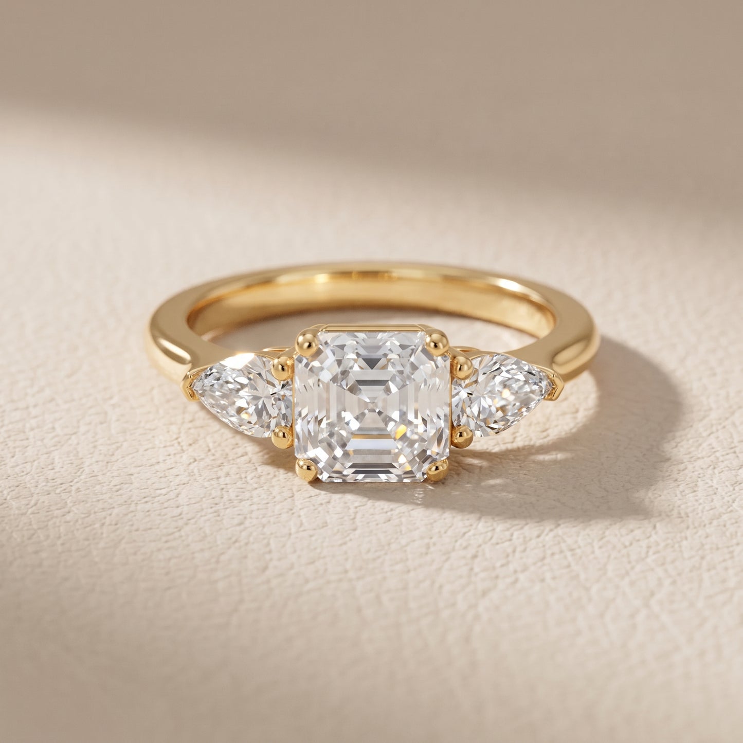 Mirabel Three-Stone Asscher Diamond Engagement Ring in Yellow Gold - front.jpg