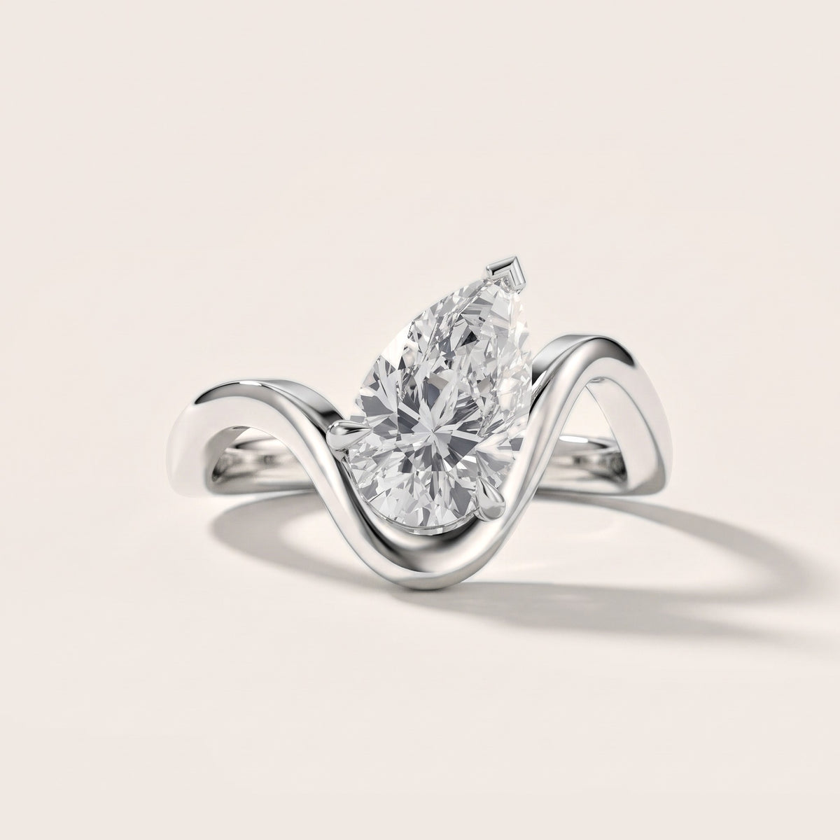 Empire Solitaire Bypass Pear Diamond Engagement Ring in Platinum - front.jpg
