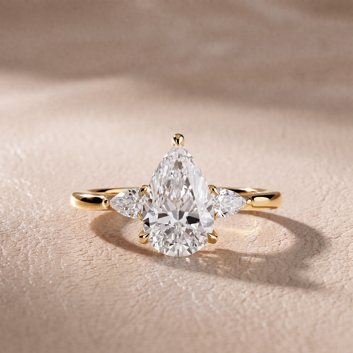 Leila Three-Stone Pear Diamond Engagement Ring in Yellow Gold - front.jpg