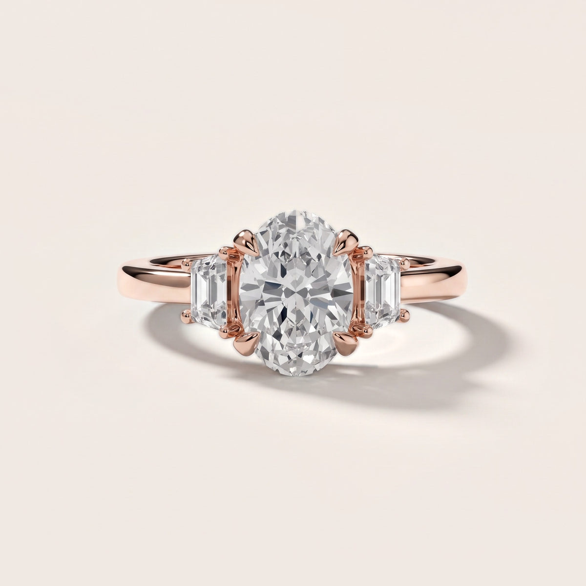Eureka Trapezoid Three-Stone Oval Diamond Engagement Ring in Rose Gold - front.jpg