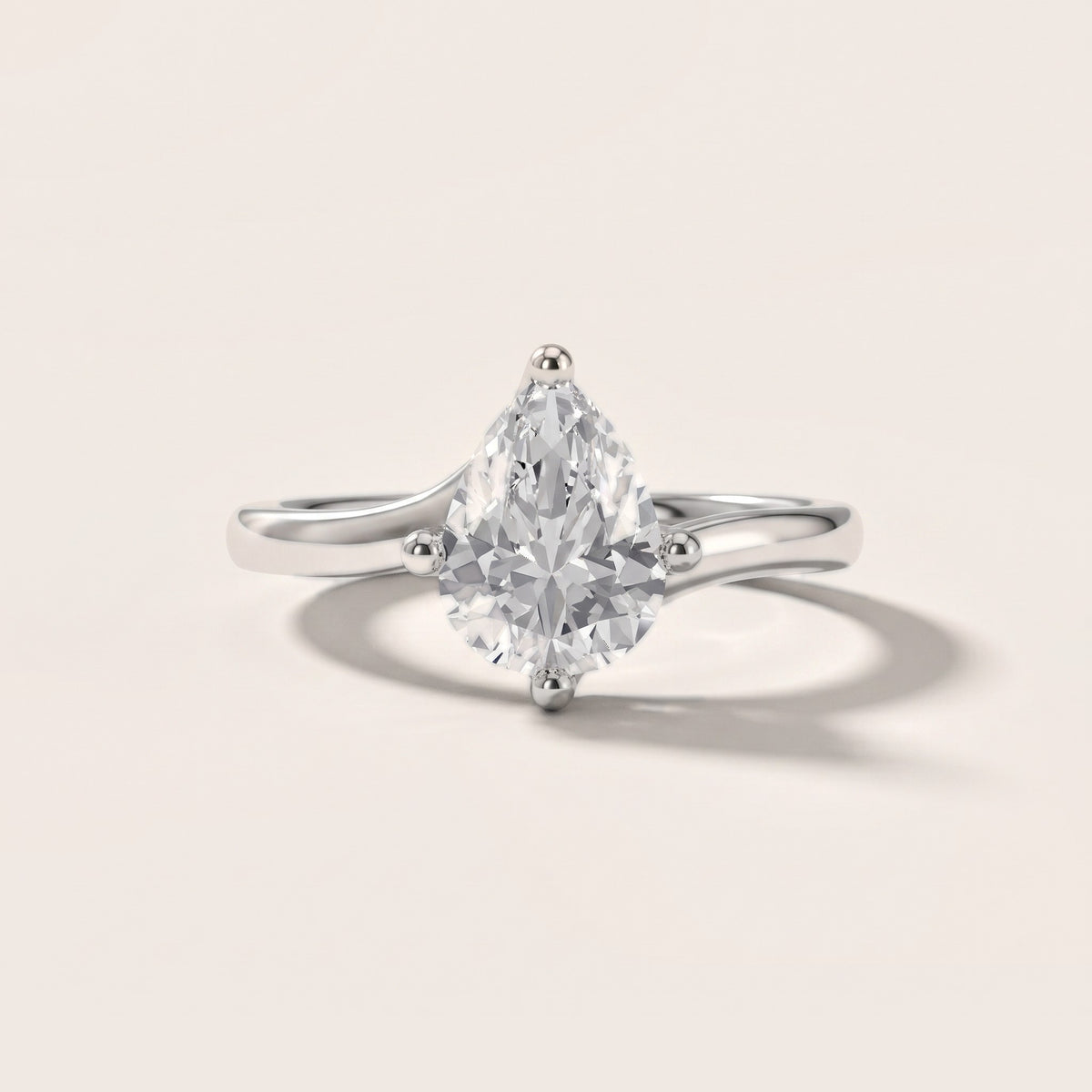 Clio Bypass Solitaire Pear Diamond Engagement Ring in Silver - front.jpg