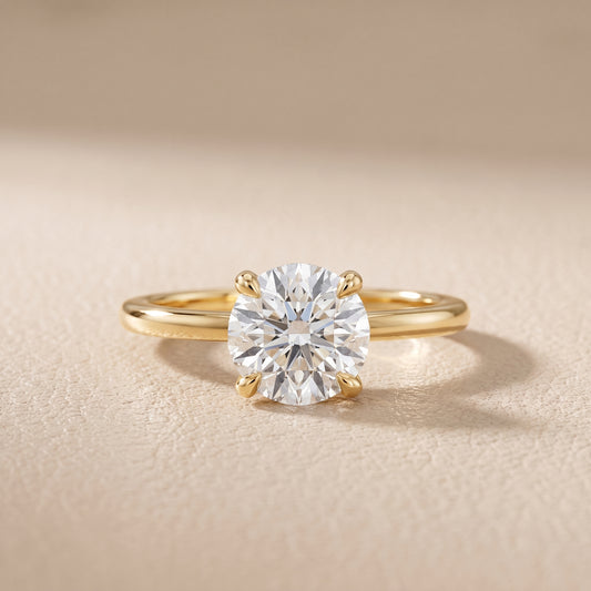 Nella Petite Solitaire Round Diamond Engagement Ring in Yellow Gold - front.jpg