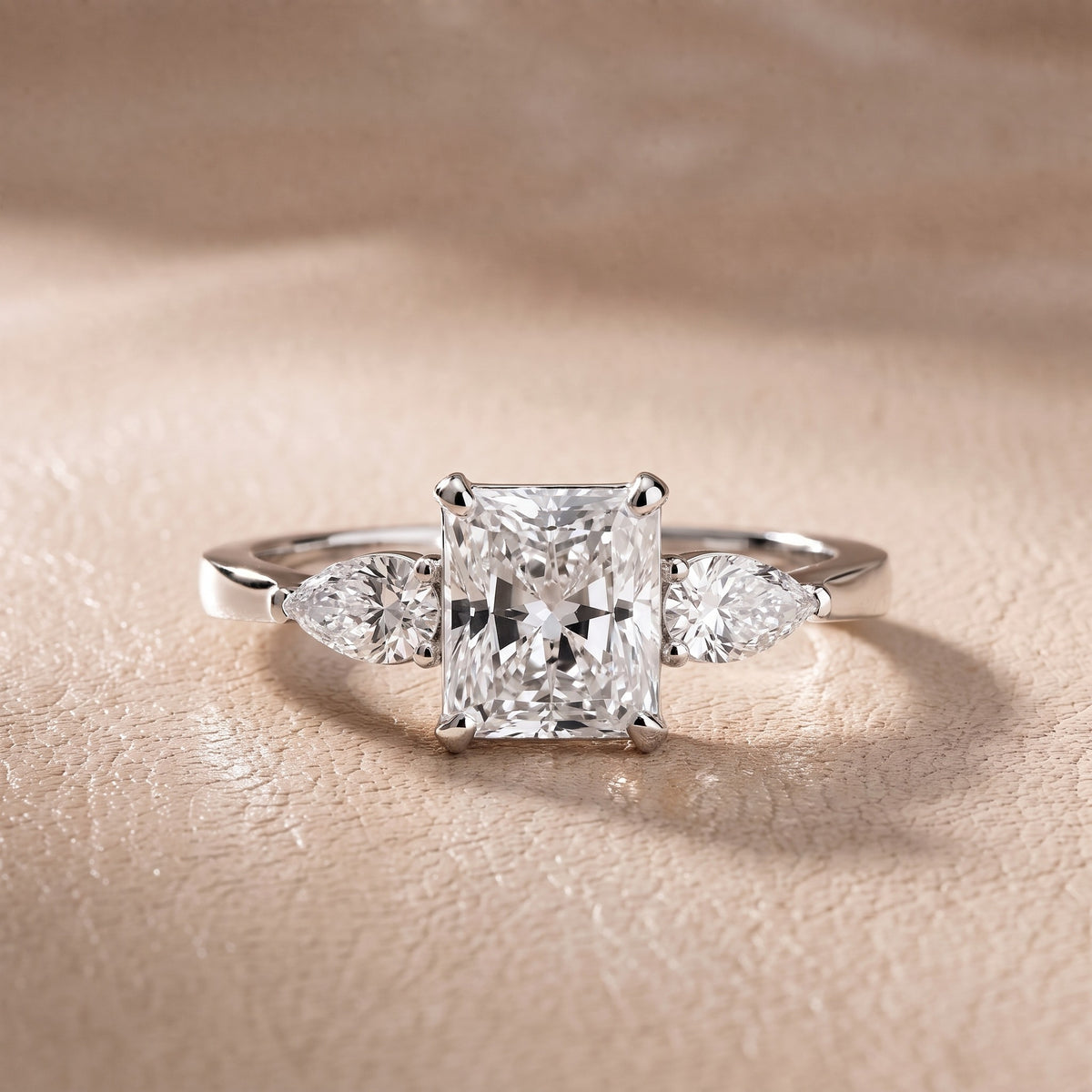 Grace Three Stone Radiant Diamond Engagement Ring in Platinum - front.jpg