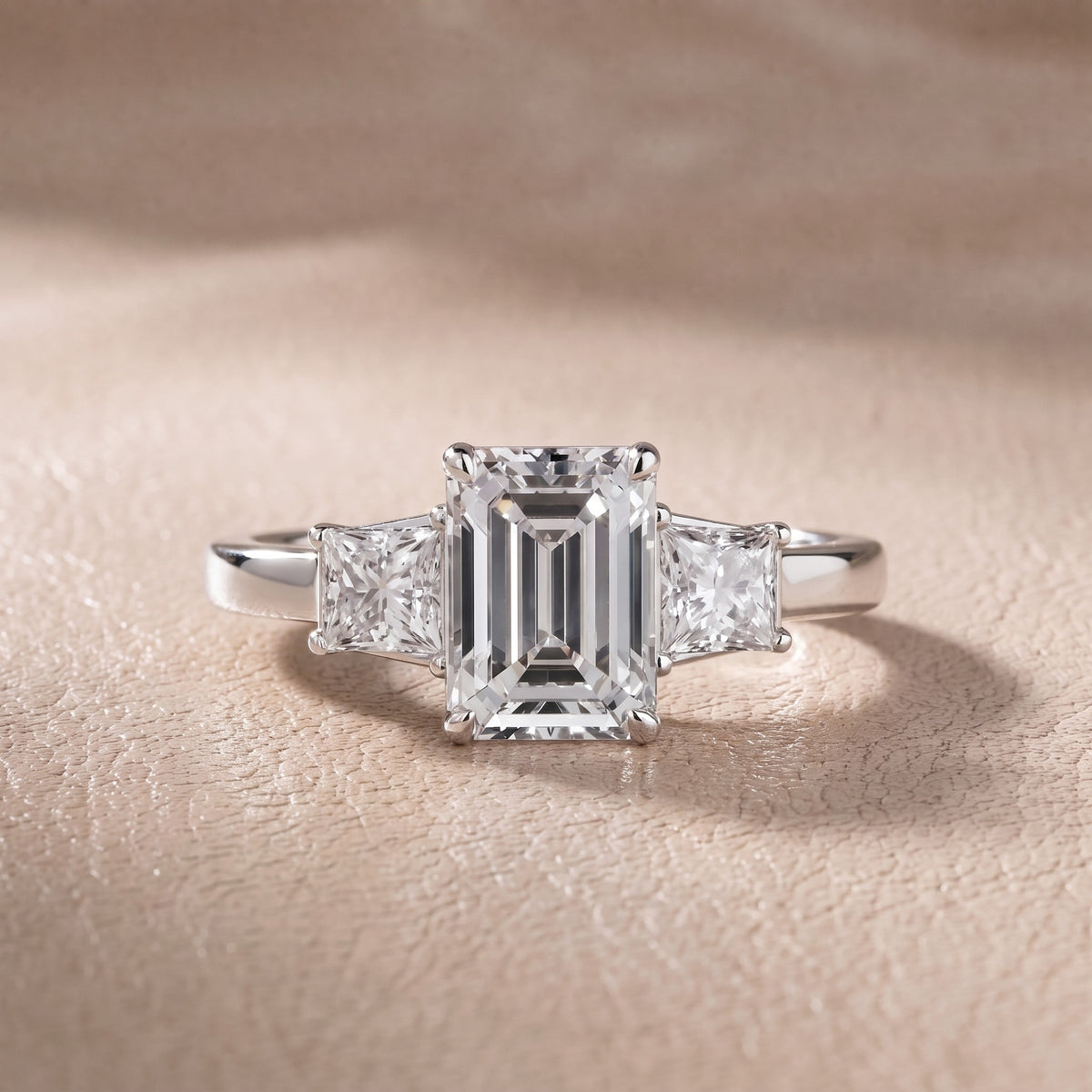 Aria Three-Stone Basket Emerald Diamond Engagement Ring in Platinum - front.jpg