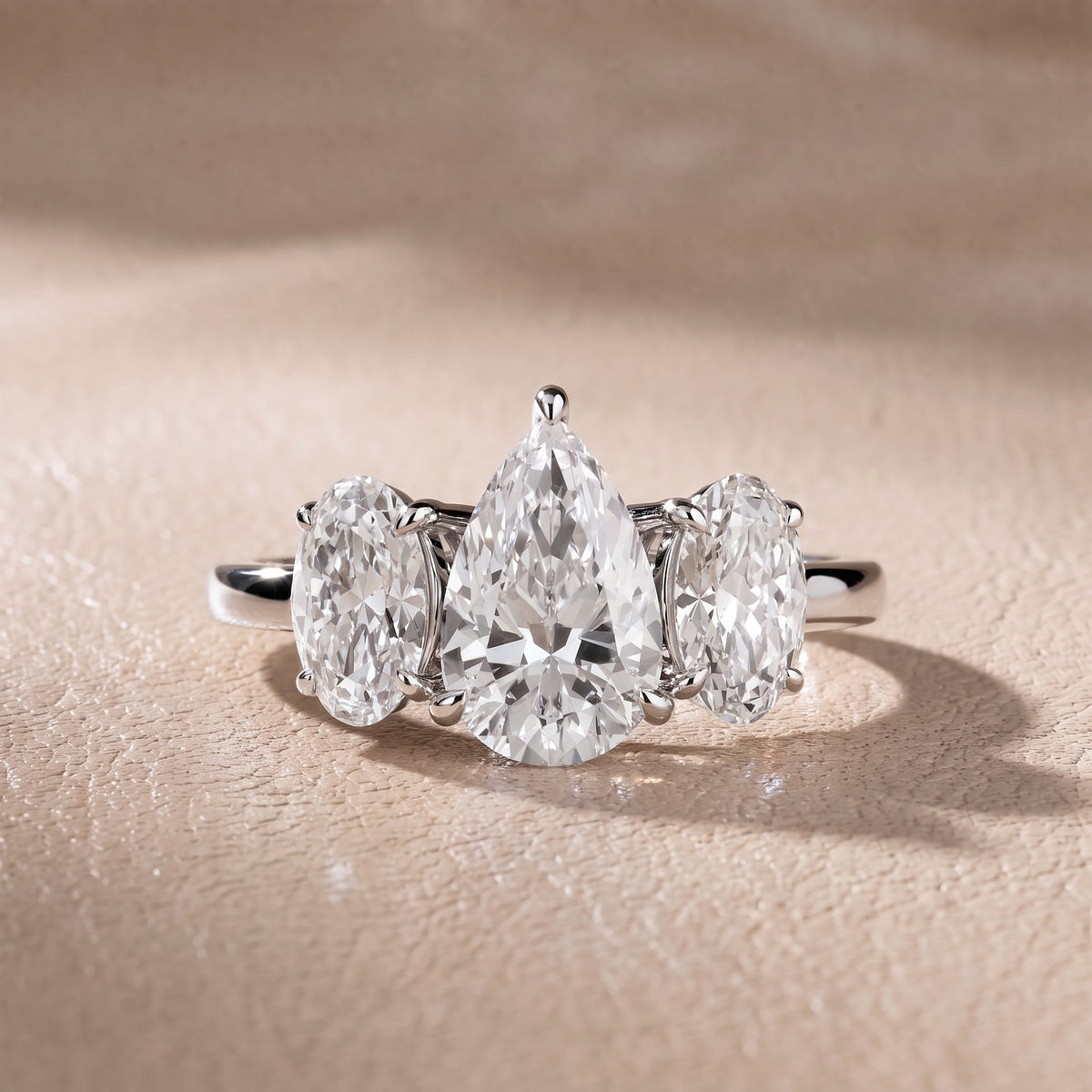 Lila Three-Stone Pear Diamond Engagement Ring in White Gold - front.jpg