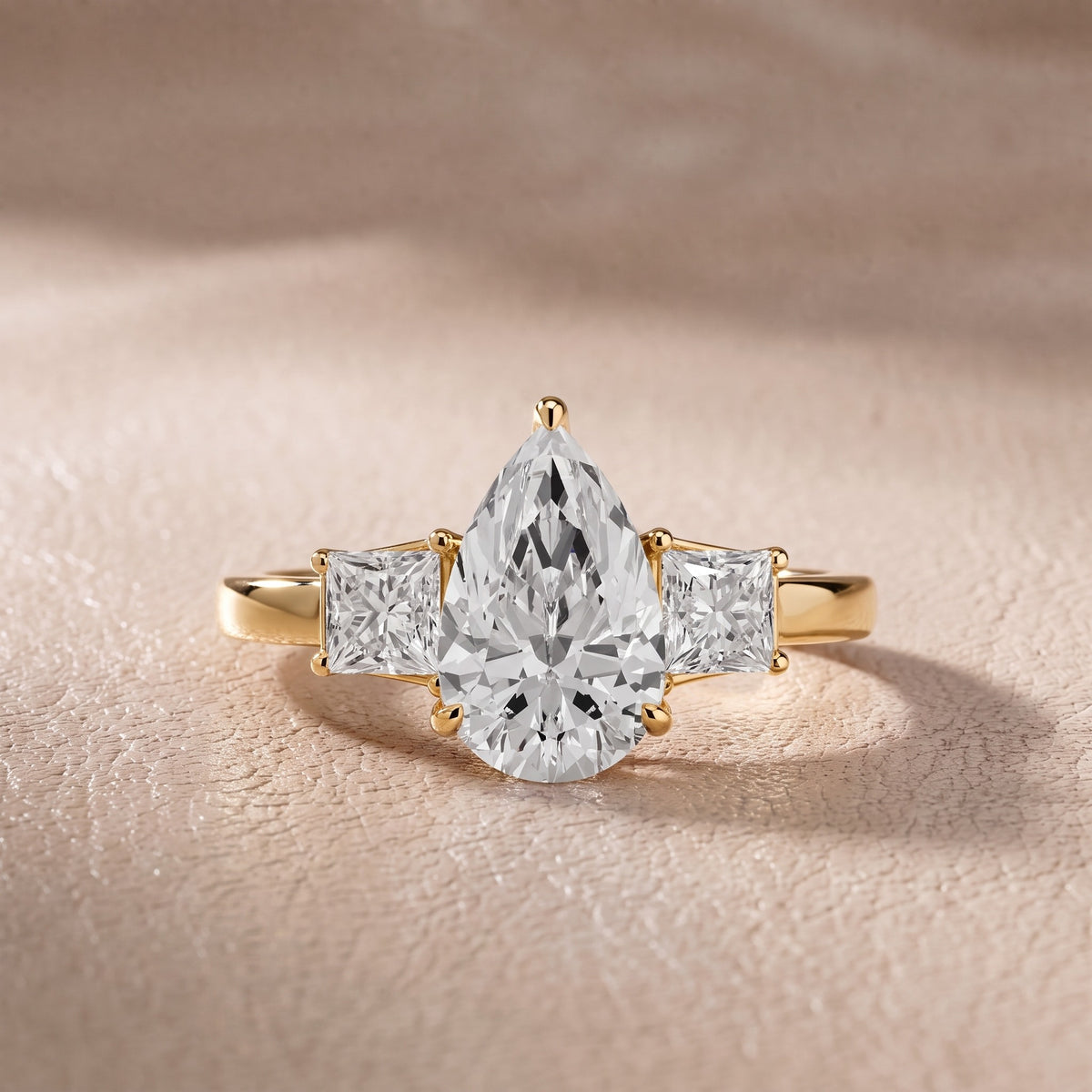 Aria Three-Stone Basket Pear Diamond Engagement Ring in Yellow Gold - front.jpg