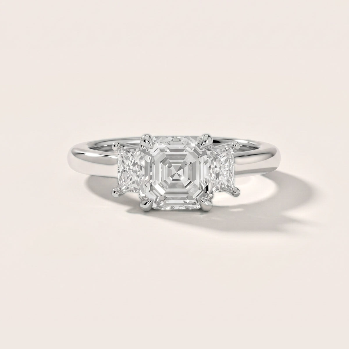 Cosette Statement Three-Stone Asscher Diamond Engagement Ring in Platinum - front.jpg