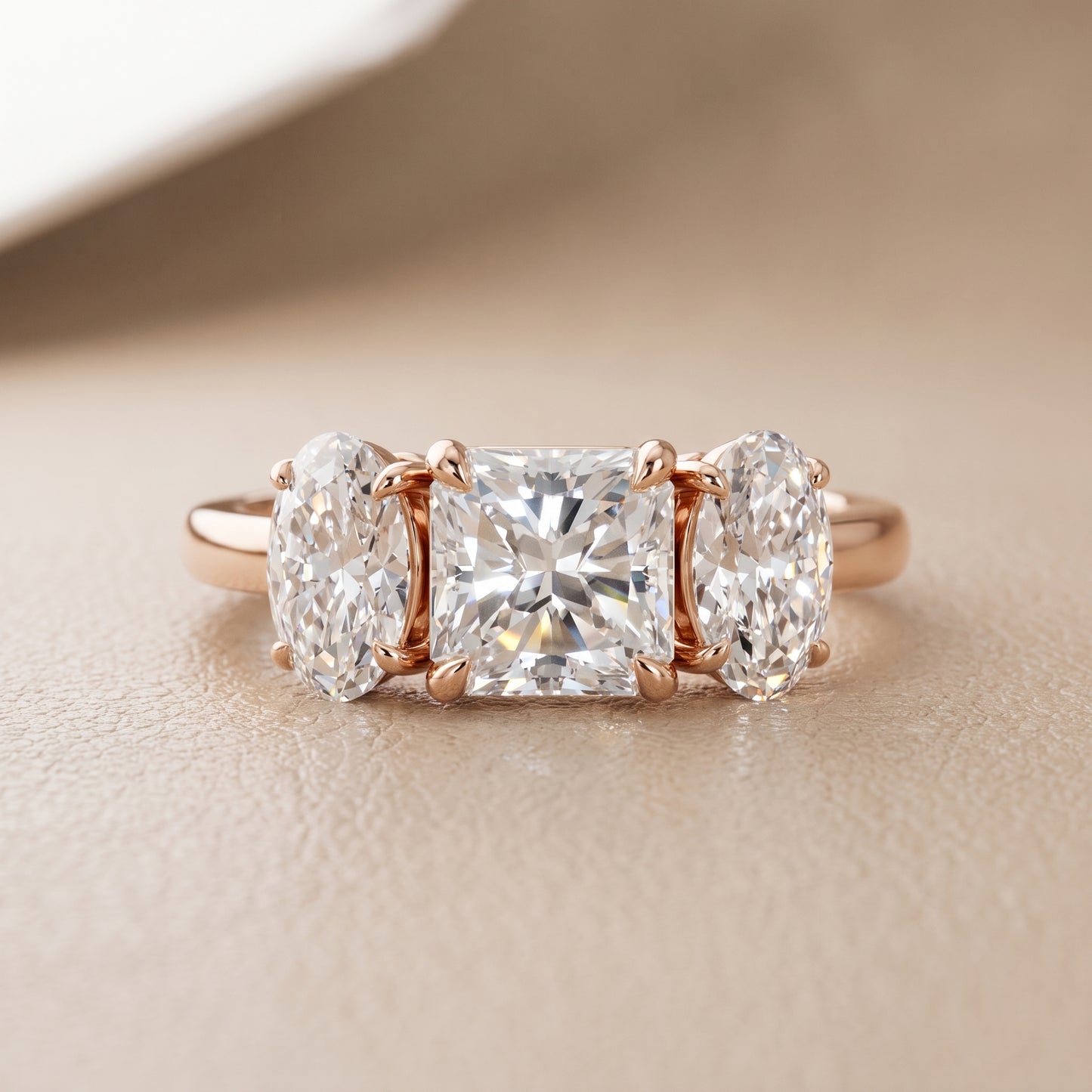 Lila Three-Stone Radiant Diamond Ring in Rose Gold - front.jpg