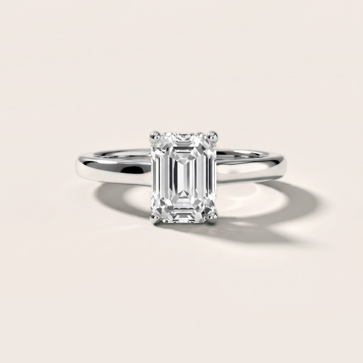 Emeline Solitaire Cathedral Emerald Diamond Engagement Ring in Platinum - front.jpg
