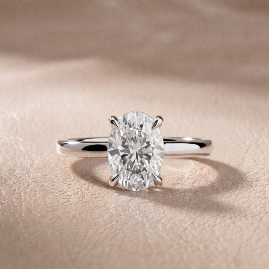 Cassandra Claw Prong Solitaire Oval Diamond Engagement Ring in Platinum - front.jpg