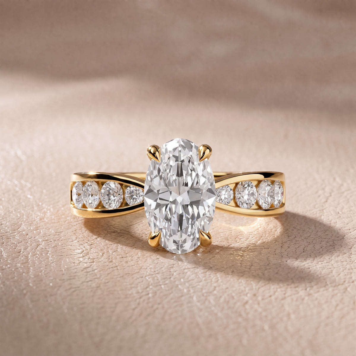 Rosalie Channel Set Sidestone Oval Diamond Engagement Ring in Yellow Gold - front.jpg