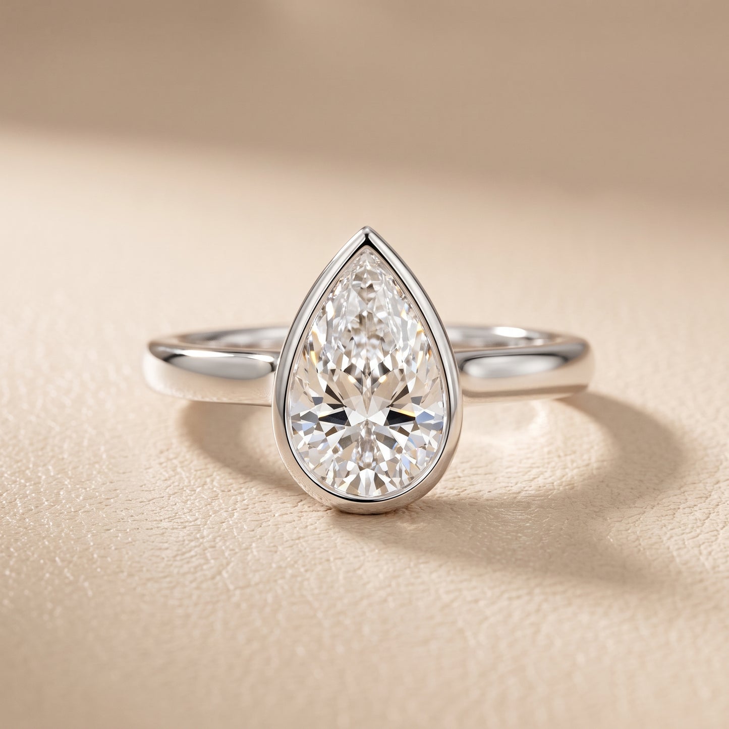 Jolie Bezel Solitaire Pear Diamond Engagement Ring in Platinum - front.jpg