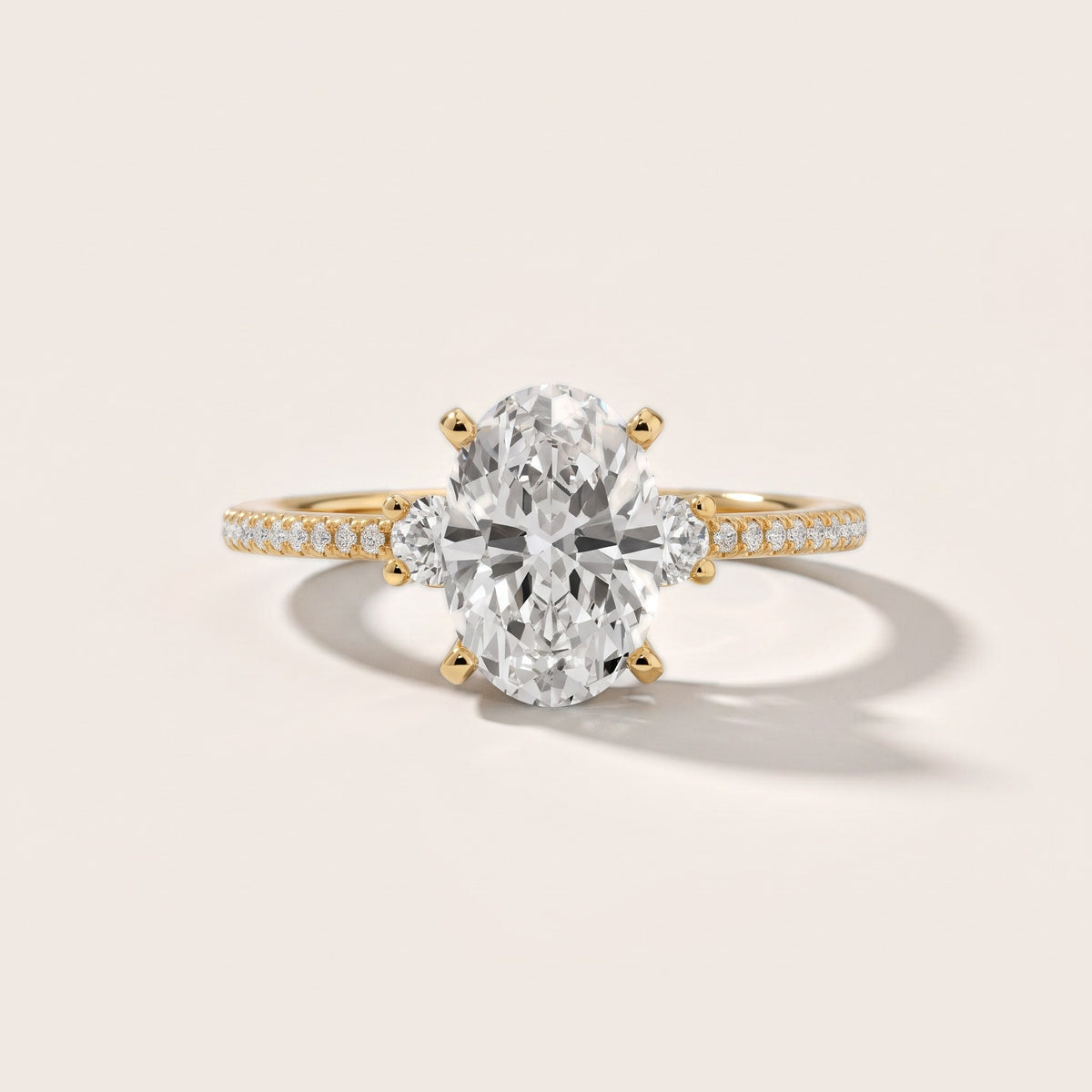 Nerissa Three-Stone Micropavé Oval Diamond Engagement Ring in Yellow Gold - front.jpg
