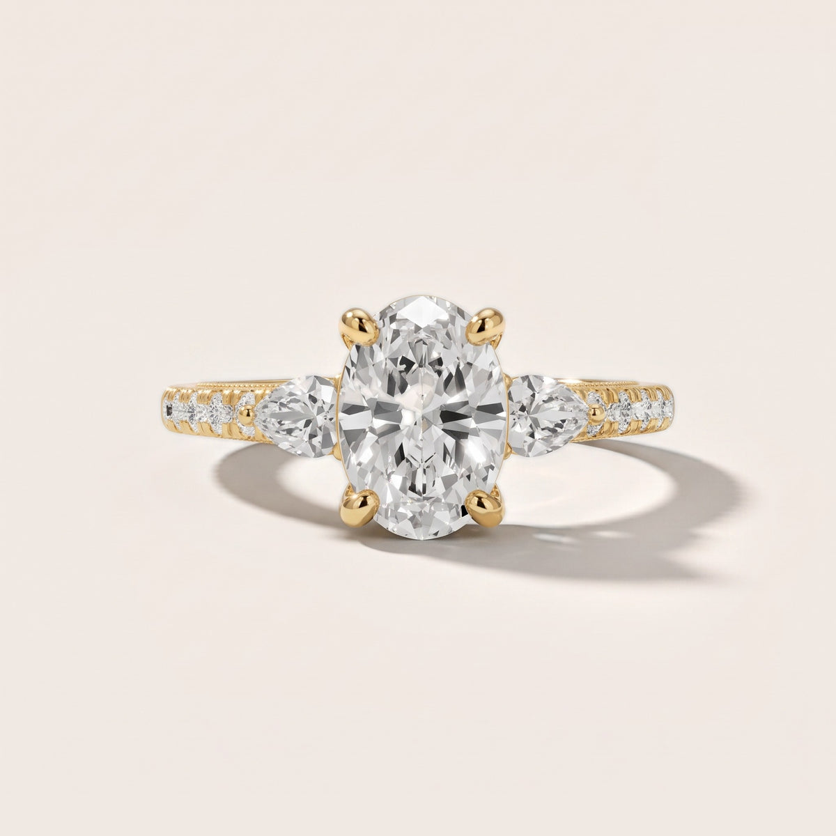 Weston Pear-Side Three-Stone Oval Diamond Engagement Ring in Yellow Gold - front.jpg