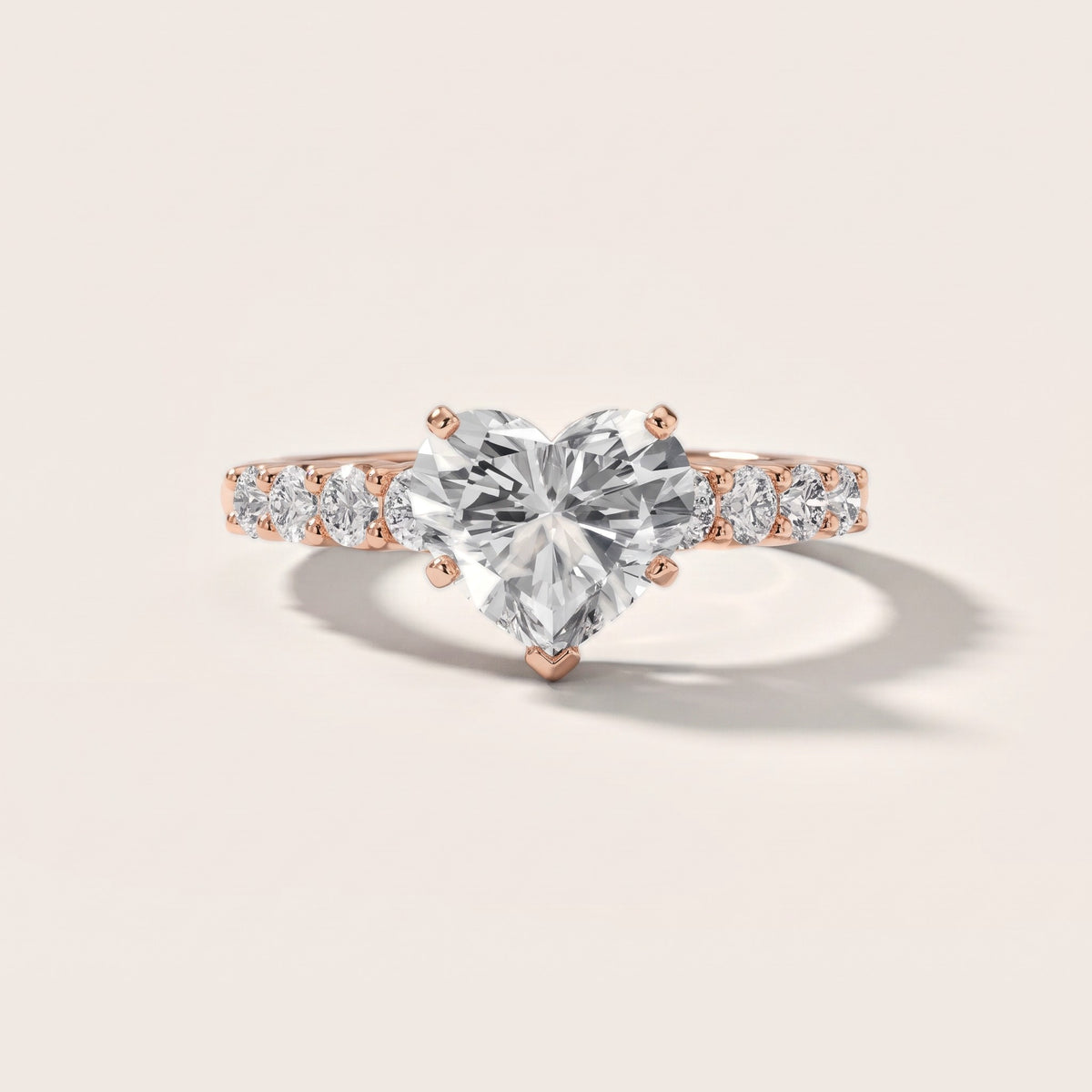 Augusta Graduated Pavé Heart Diamond Engagement Ring in Rose Gold - front.jpg