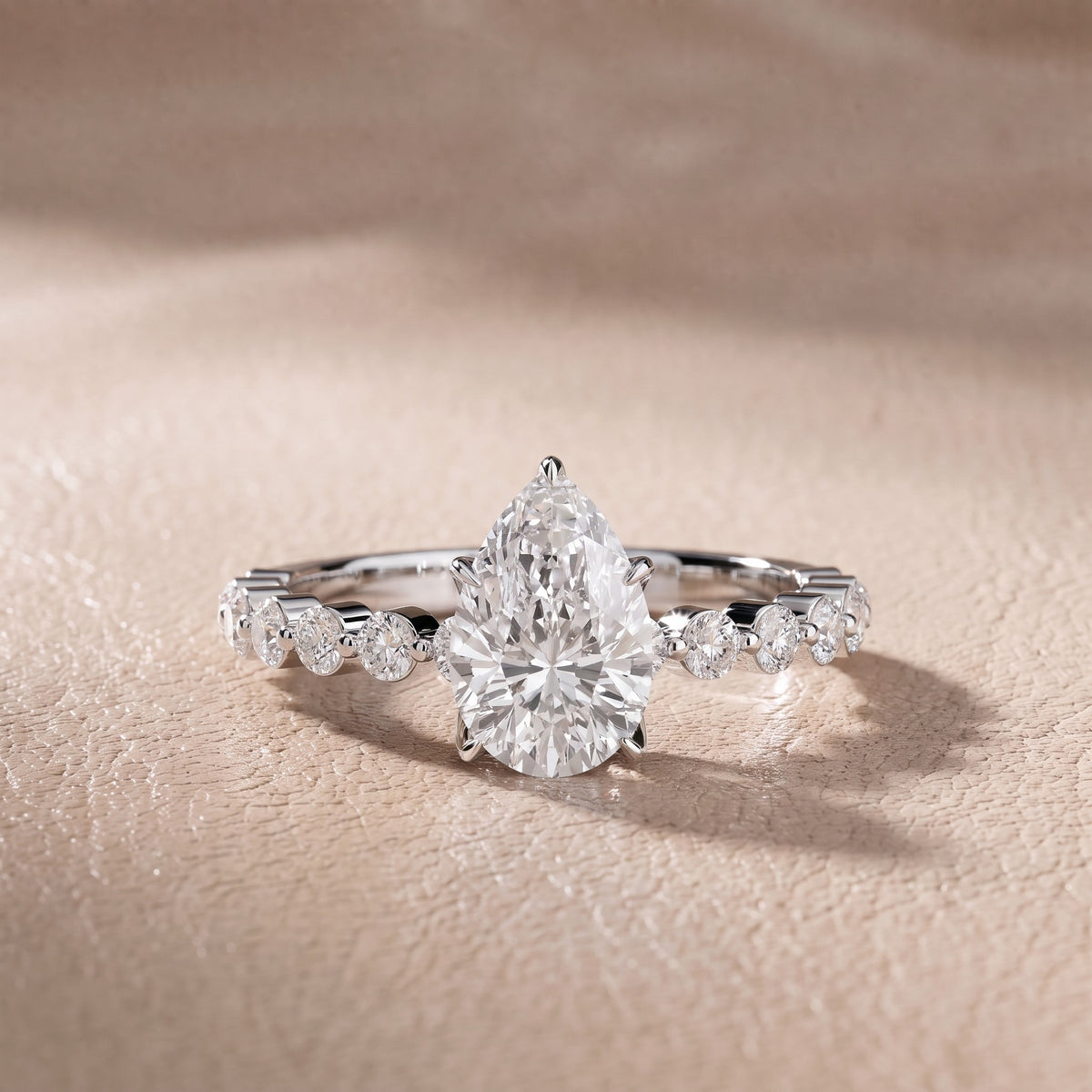 Eleanor Majesty Side Stone Pear Diamond Engagement Ring in Platinum - front.jpg