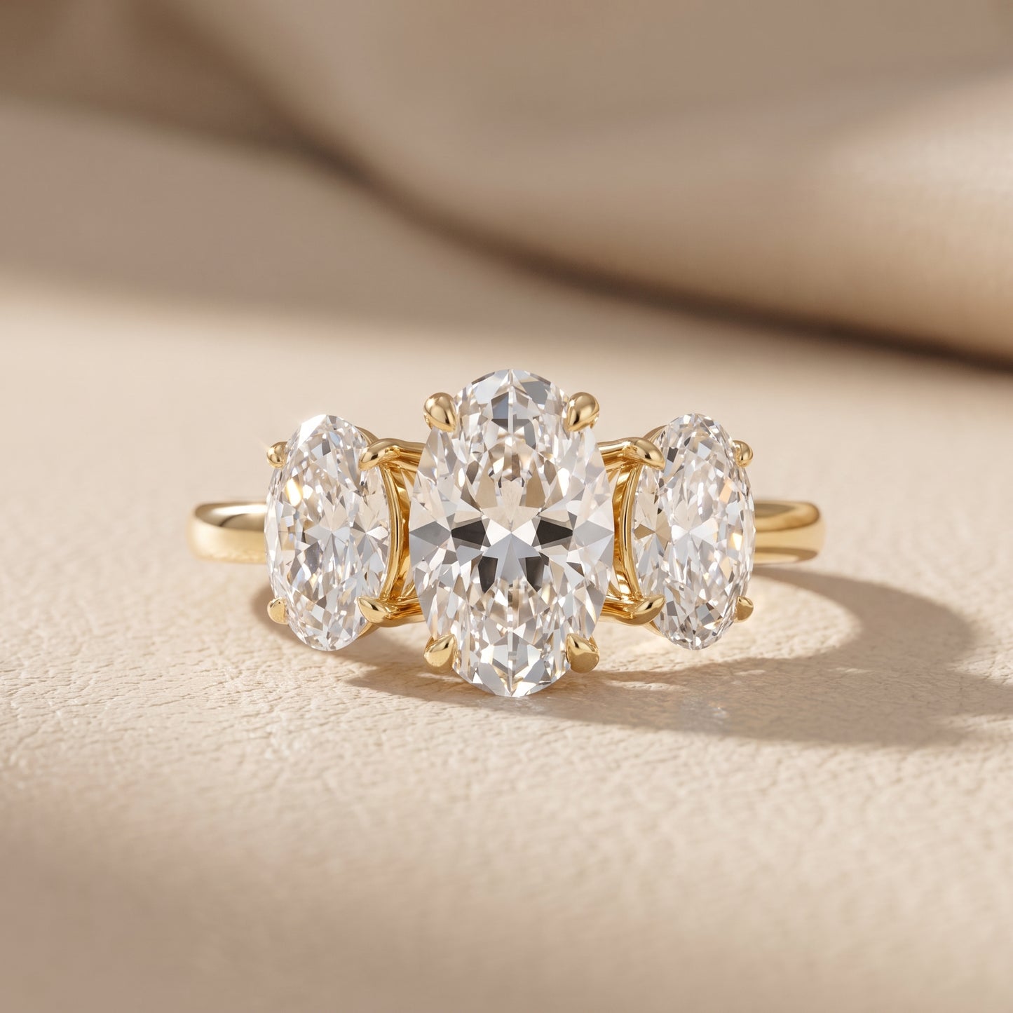 Lila Three-Stone Oval Diamond Ring in Yellow Gold - front.jpg