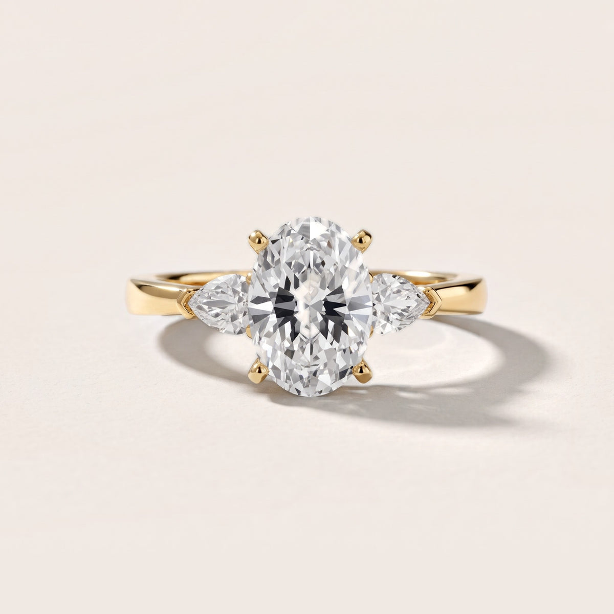 Amabel Three-Stone Oval Diamond Engagement Ring in Yellow Gold - front.jpg