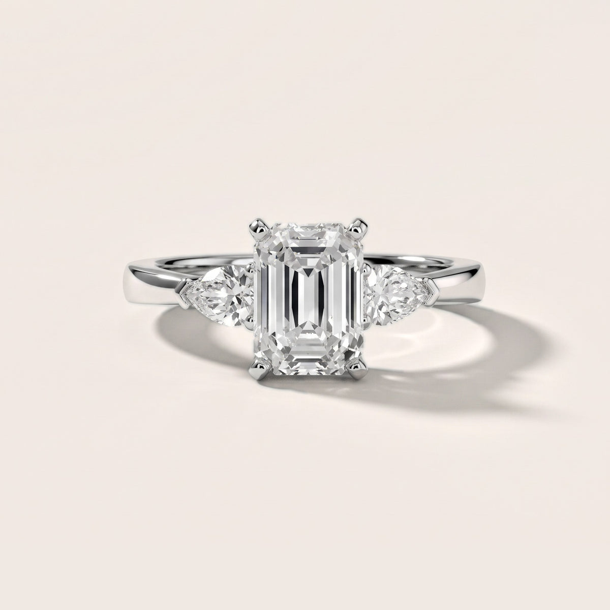 Amabel Three-Stone Emerald Diamond Engagement Ring in Silver - front.jpg