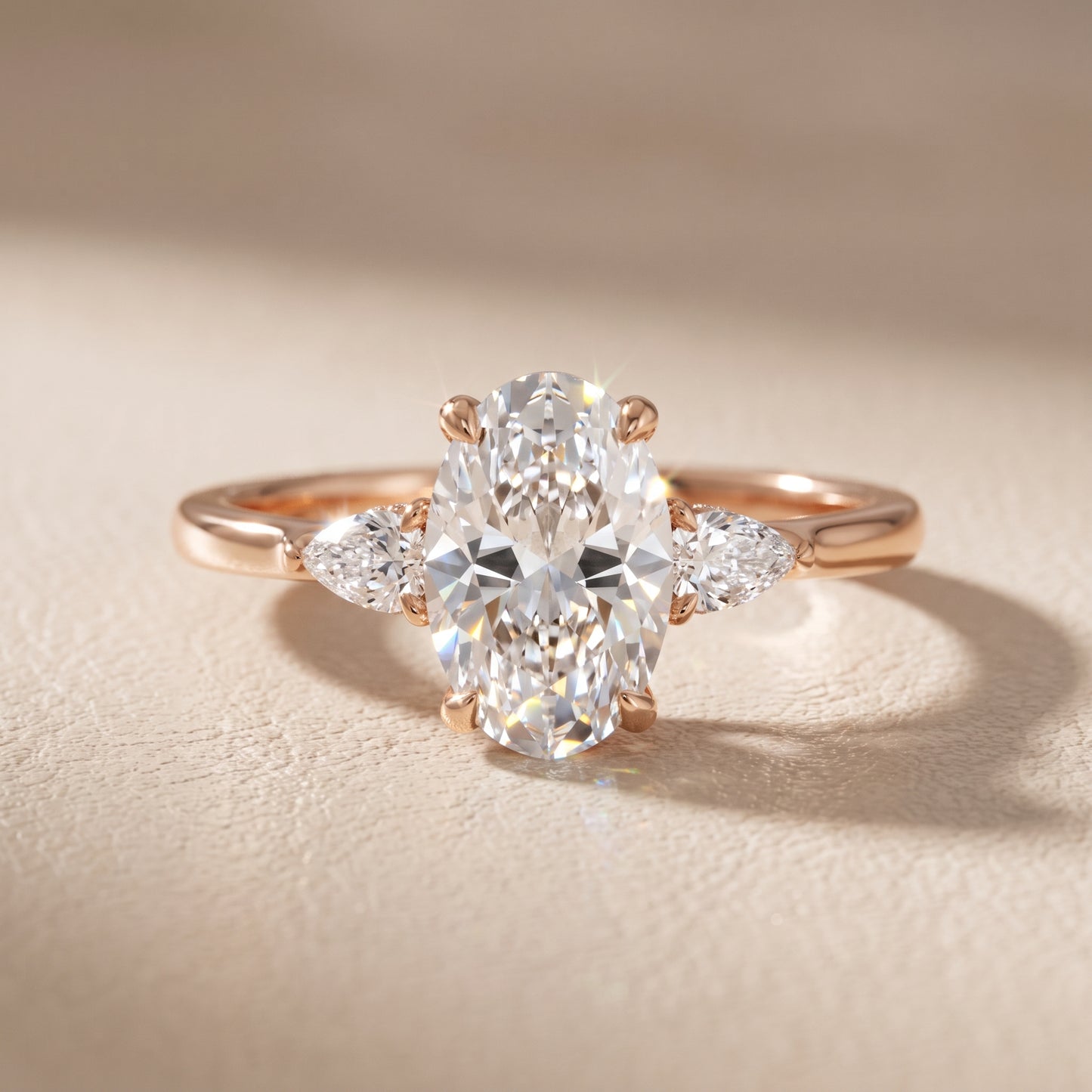 Leila Three-Stone Oval Diamond Engagement Ring in Rose Gold - front.jpg