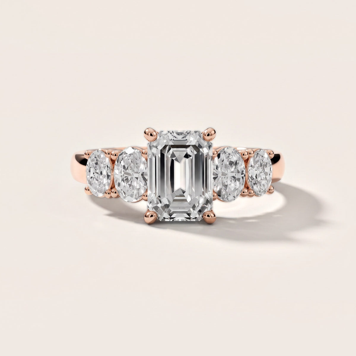 Judith Statement Five-Stone Emerald Diamond Engagement Ring in Rose Gold - front.jpg