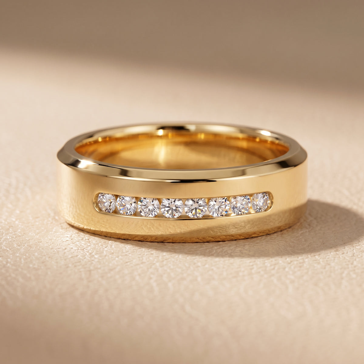 Reva Channel Set Round Diamond Wedding Band in Yellow Gold - front.jpg