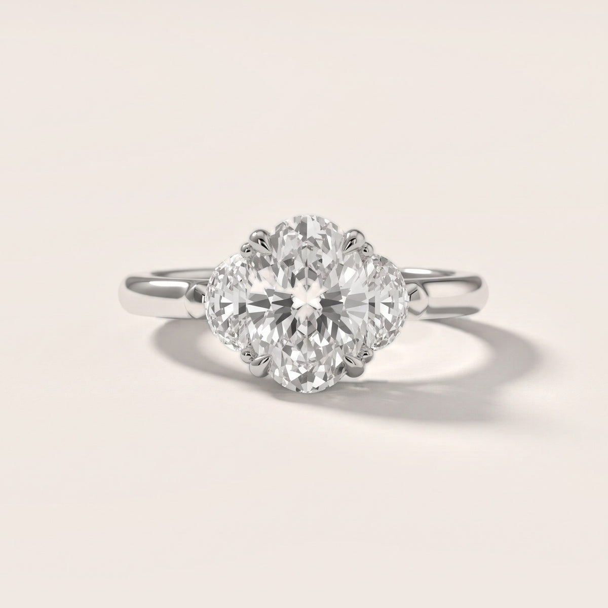 Elia Half-Moon Three-Stone Oval Diamond Engagement Ring in Platinum - front.jpg