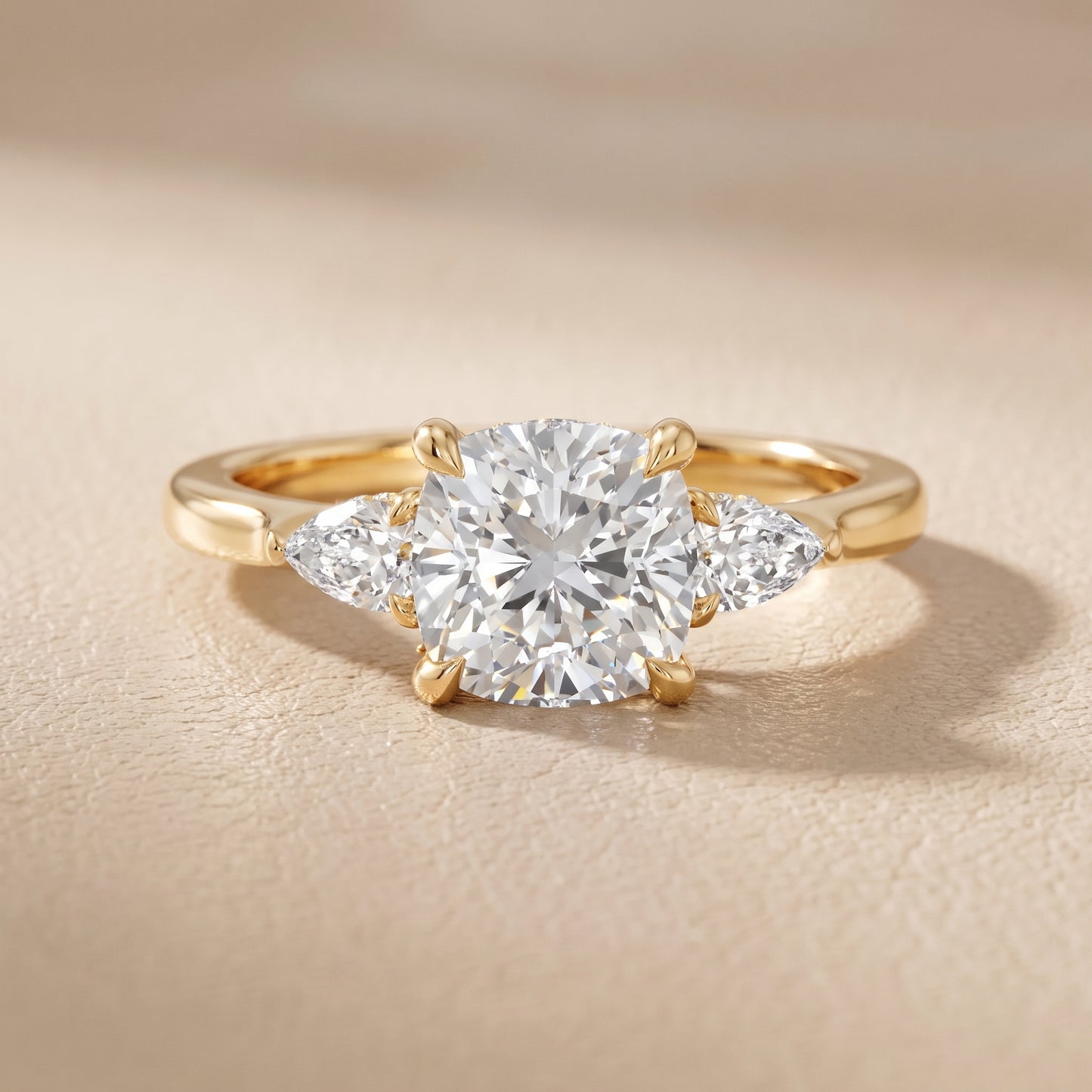 Leila Three-Stone Cushion Diamond Engagement Ring in Yellow Gold - front.jpg