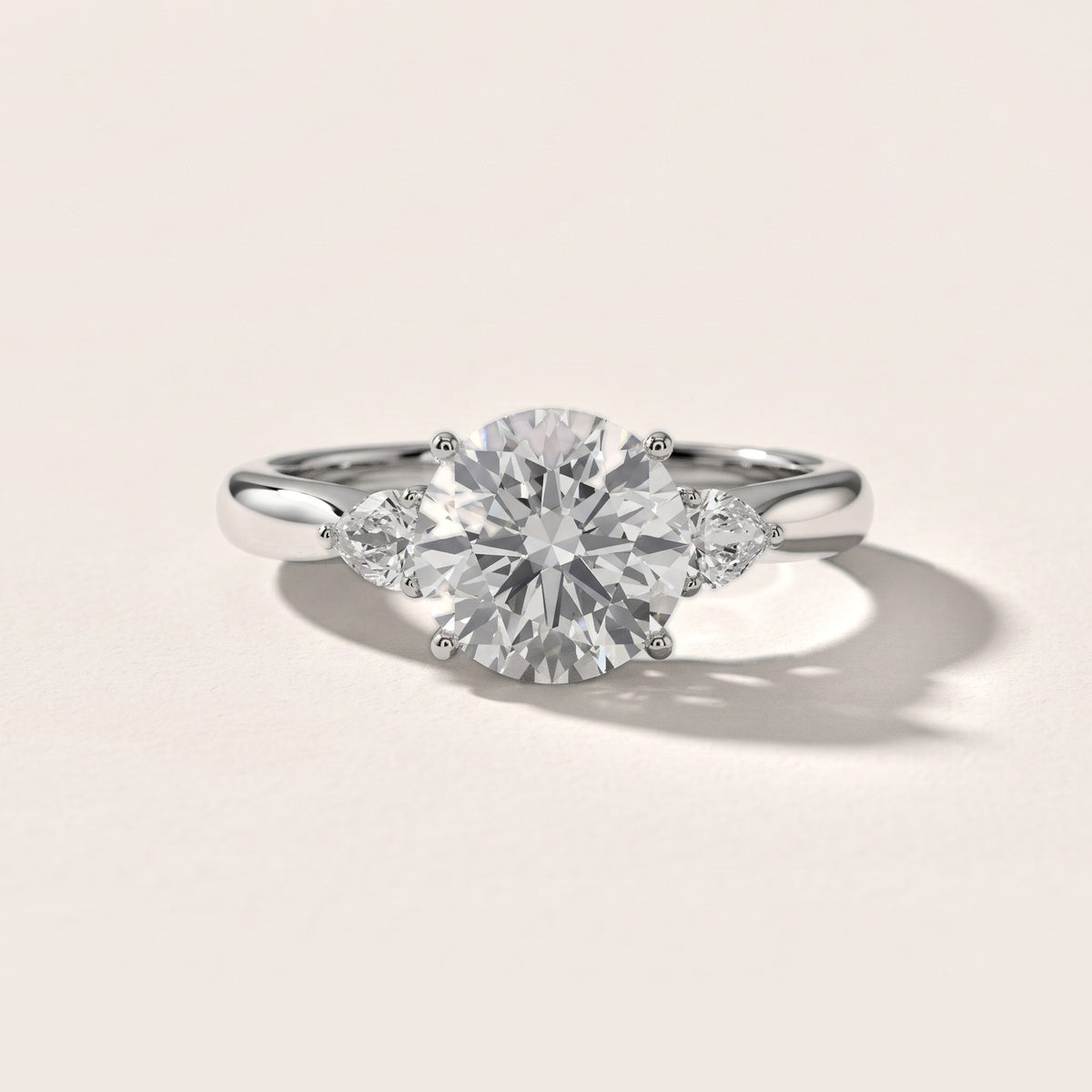 Loretta Three-Stone Cathedral Round Diamond Engagement Ring in Silver - front.jpg