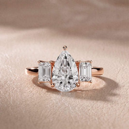 Zoe Three-Stone Pear Diamond Engagement Ring in Rose Gold - front.jpg