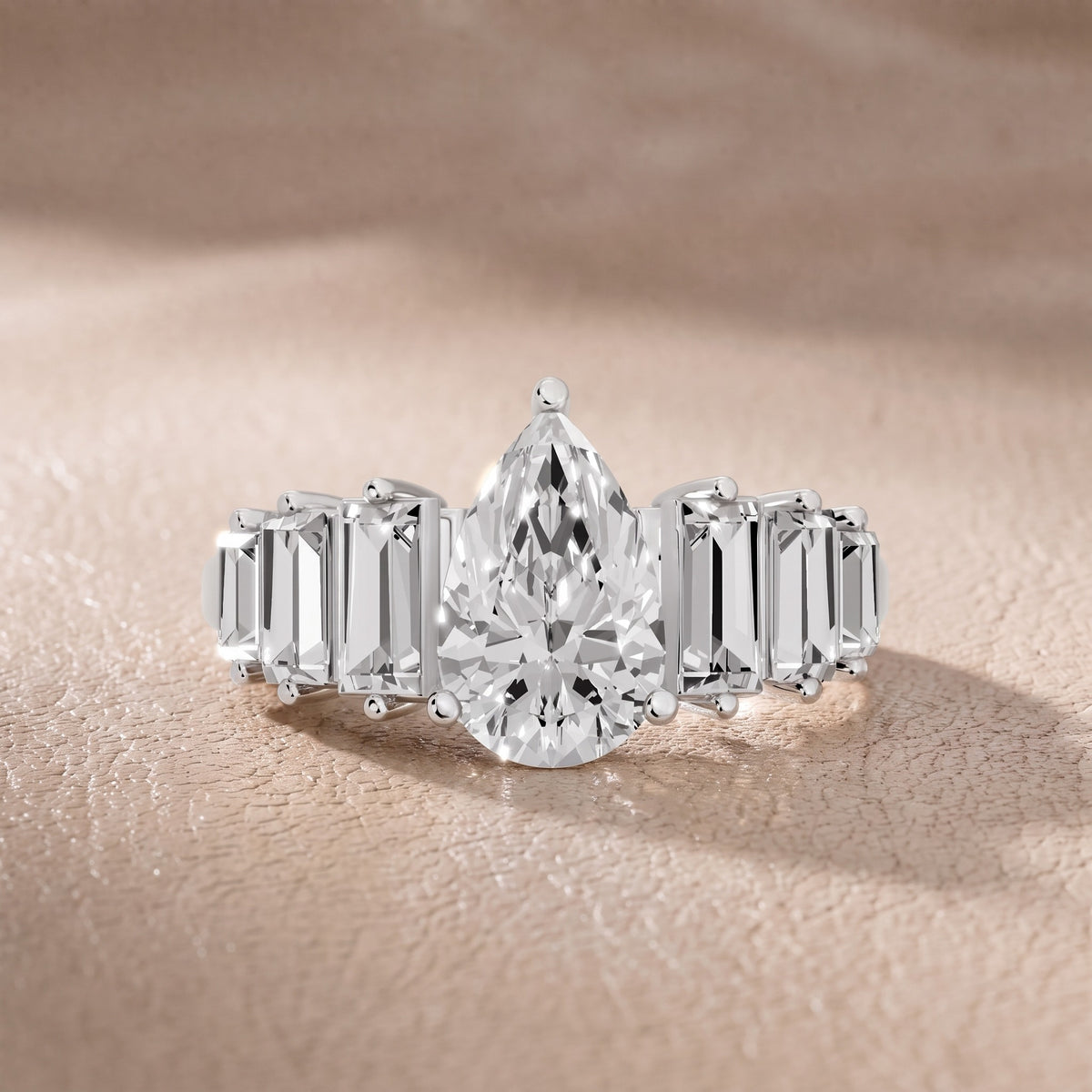 Mara Sidestone Baguette Accent Pear Diamond Engagement Ring in Silver - front.jpg