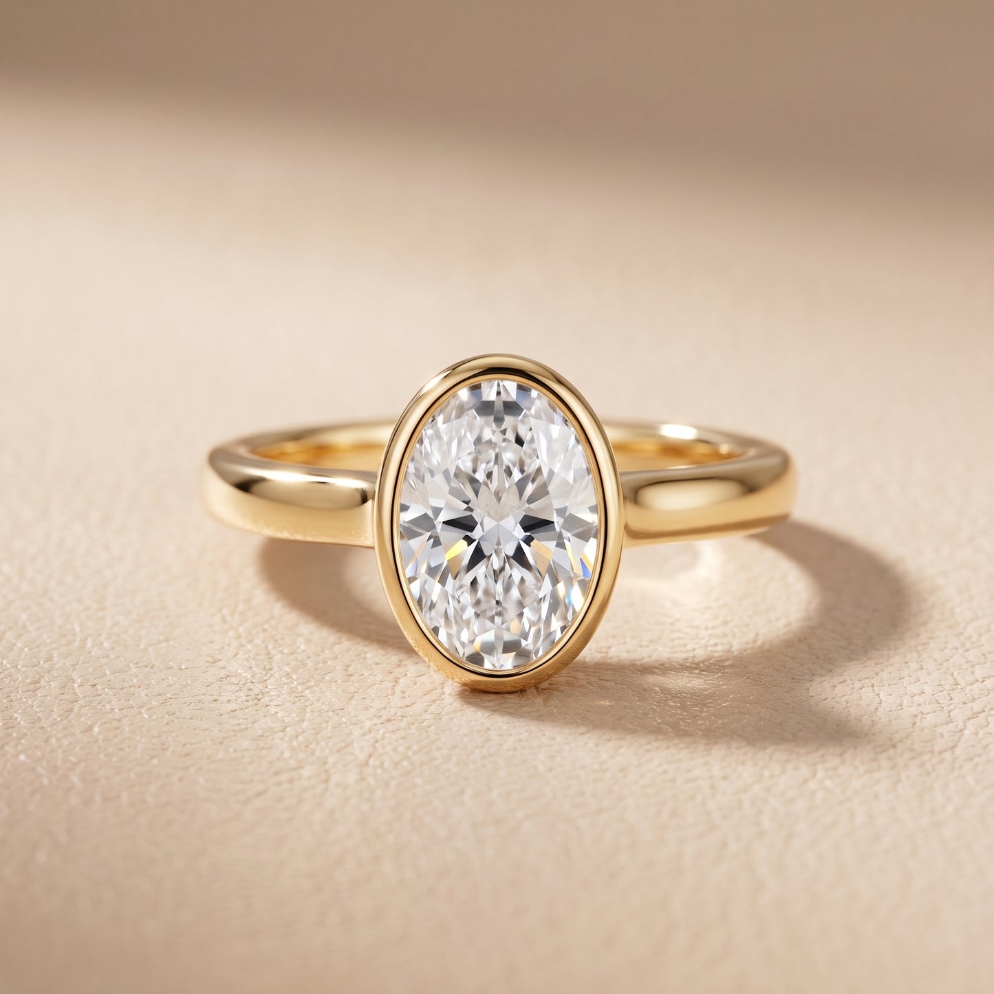 Jolie Bezel Solitaire Oval Diamond Engagement Ring in Yellow Gold - front.jpg