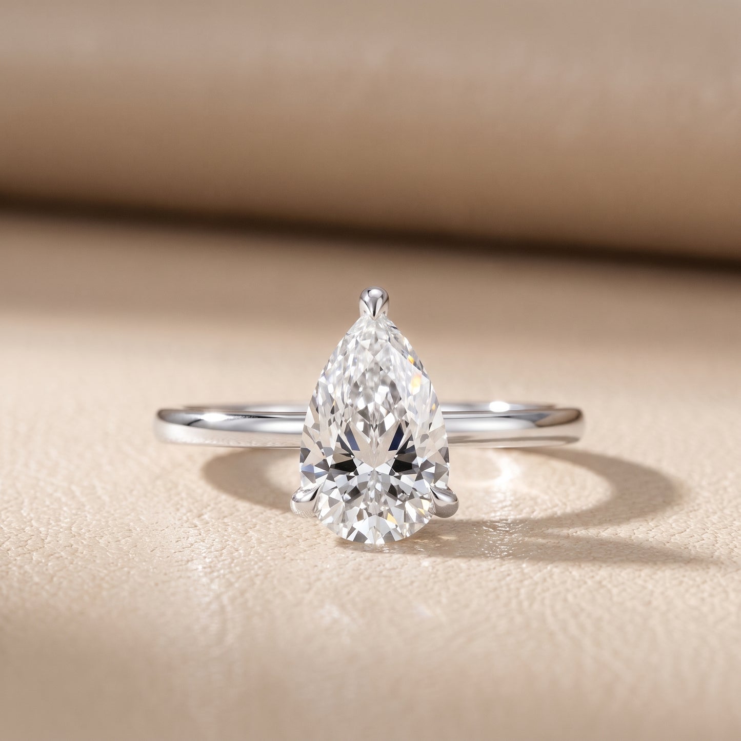 Nella Petite Solitaire Pear Diamond Engagement Ring in Platinum - front.jpg