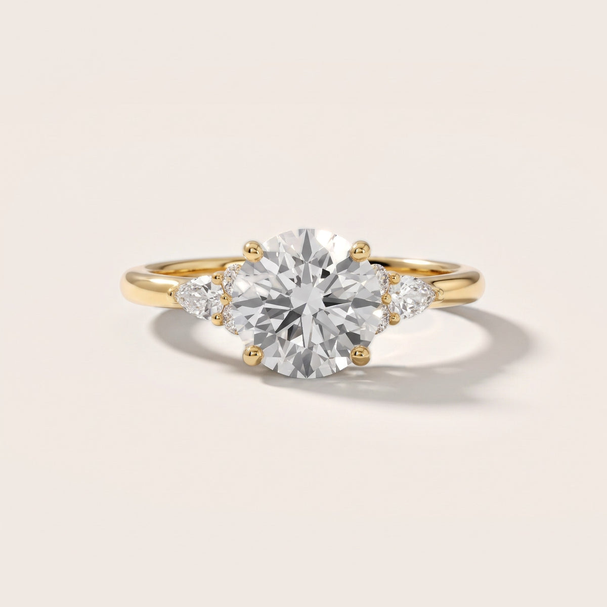 Zelie Pear-Side Cluster Round Diamond Engagement Ring in Yellow Gold - front.jpg