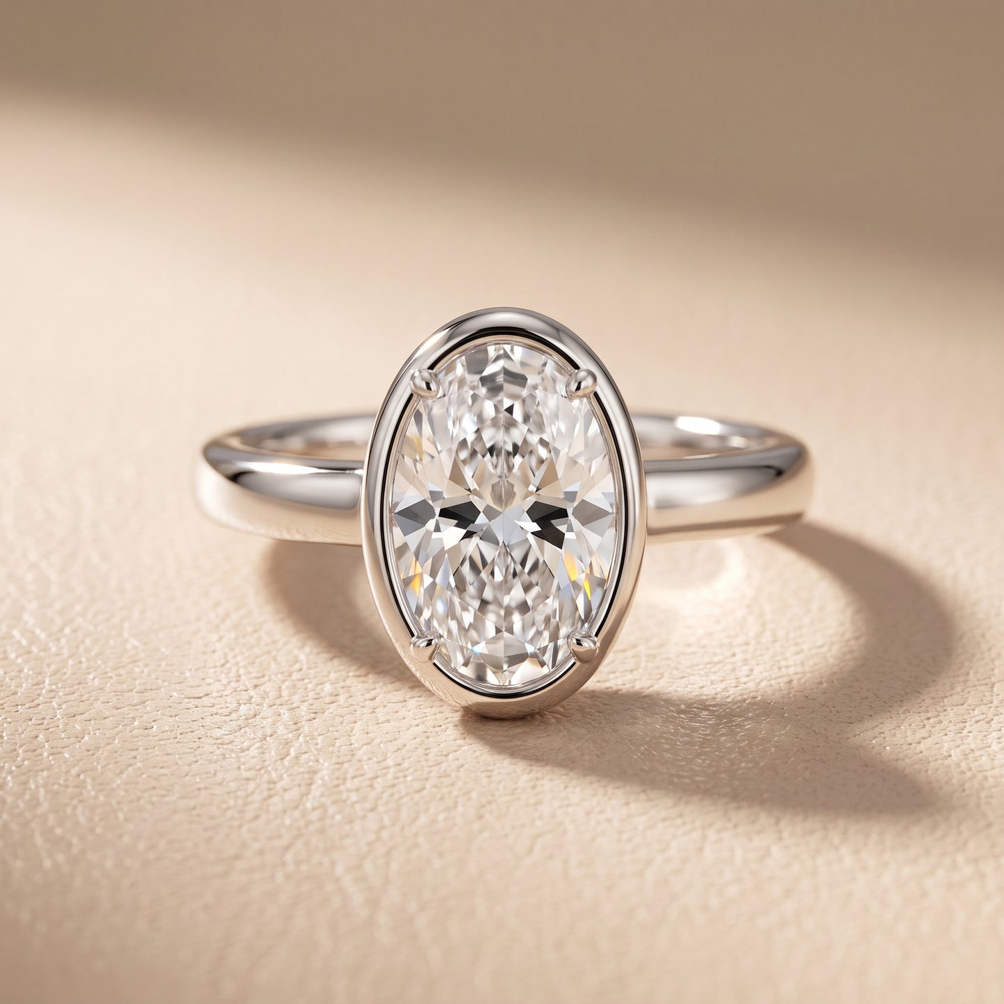 Alina Bezel Solitaire Oval Diamond Ring in Platinum - front.jpg