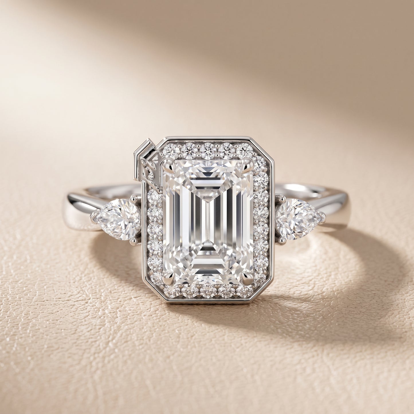Eliza Halo Sidestone Emerald Diamond Engagement Ring in Platinum - front.jpg