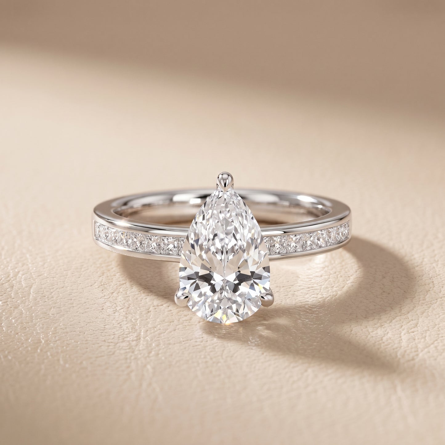 Maren Sidestone Channel Set Pear Diamond Engagement Ring in Platinum - front.jpg