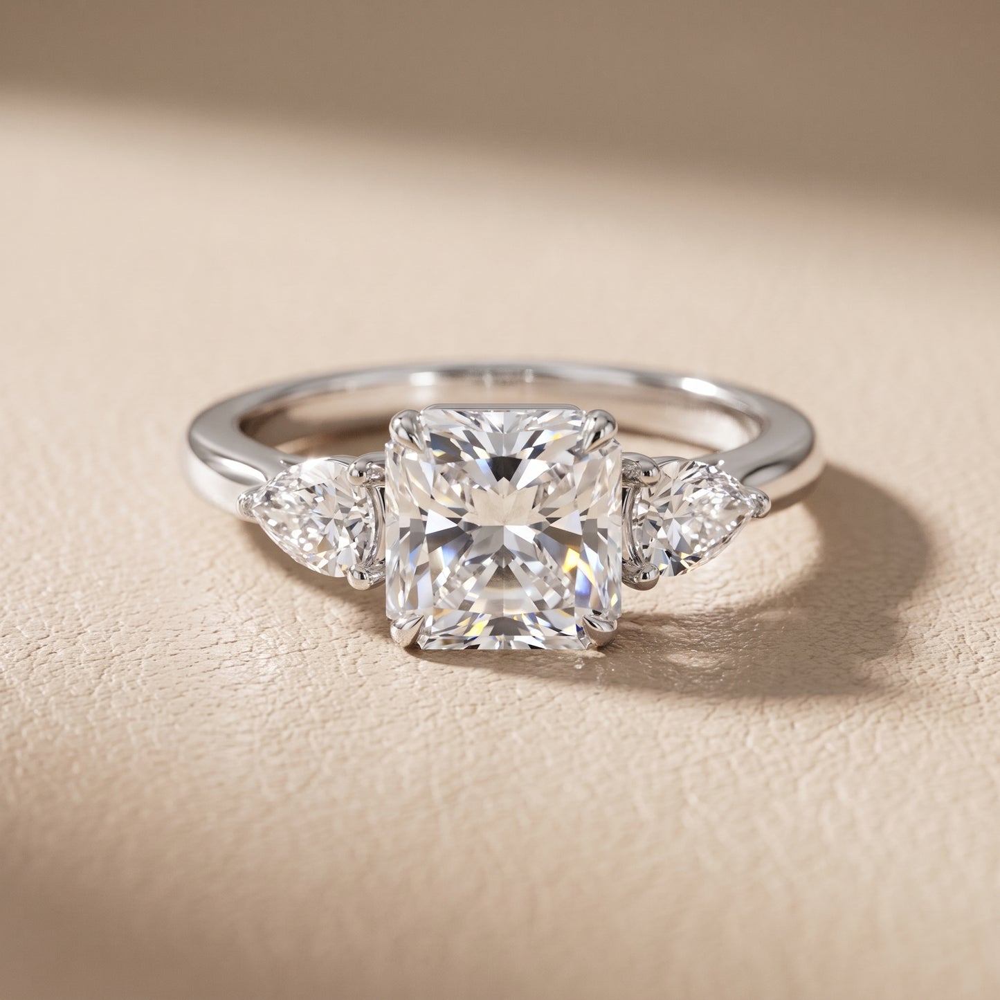 Phoebe Three-Stone Radiant Diamond Ring in Platinum - front.jpg