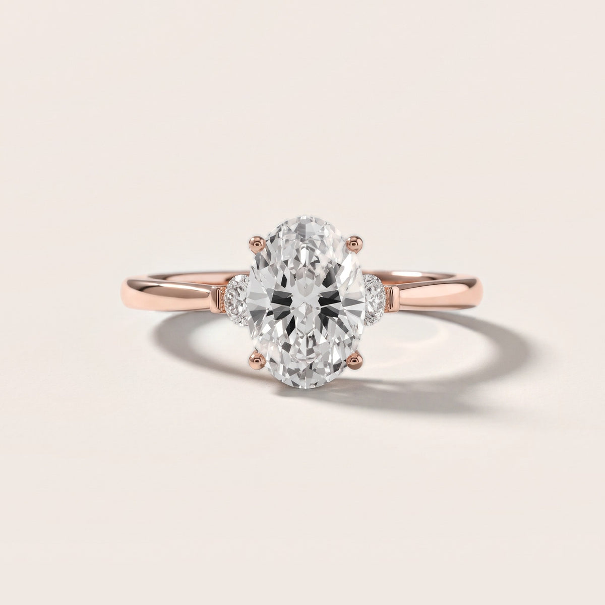 Micaela Three-Stone Oval Diamond Engagement Ring in Rose Gold - front.jpg