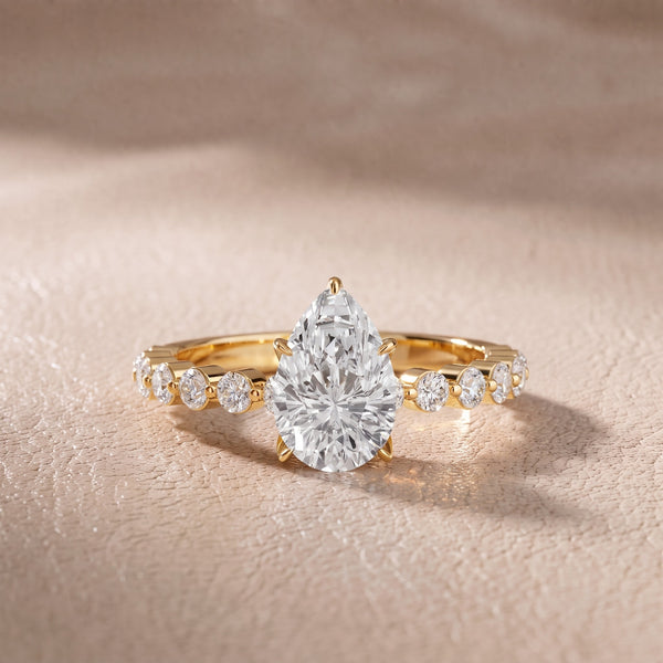 Eleanor Majesty Side Stone Pear Diamond Engagement Ring in Yellow Gold