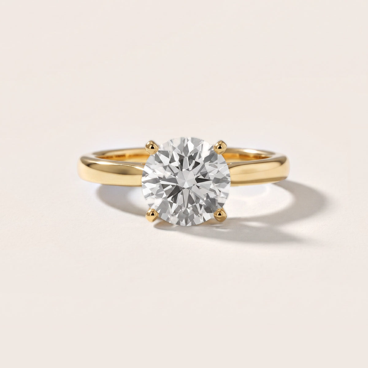 Enid Solitaire Cathedral Round Diamond Engagement Ring in Yellow Gold - front.jpg