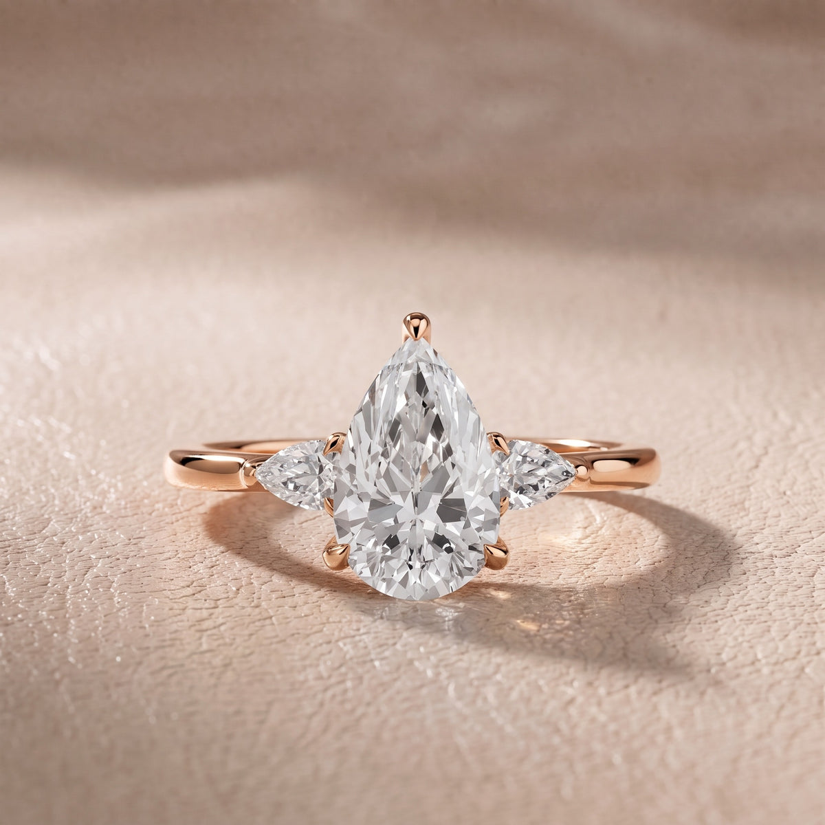 Leila Three-Stone Pear Diamond Engagement Ring in Rose Gold - front.jpg