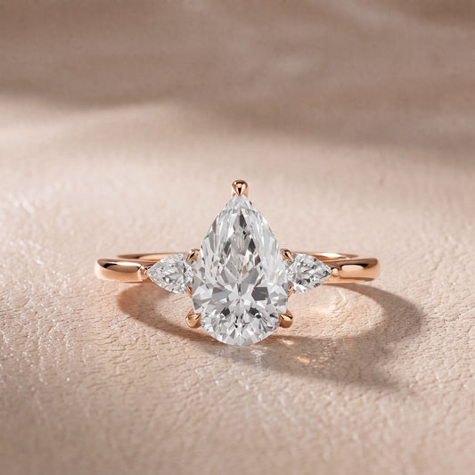 Leila Three-Stone Pear Diamond Engagement Ring in Rose Gold - front.jpg