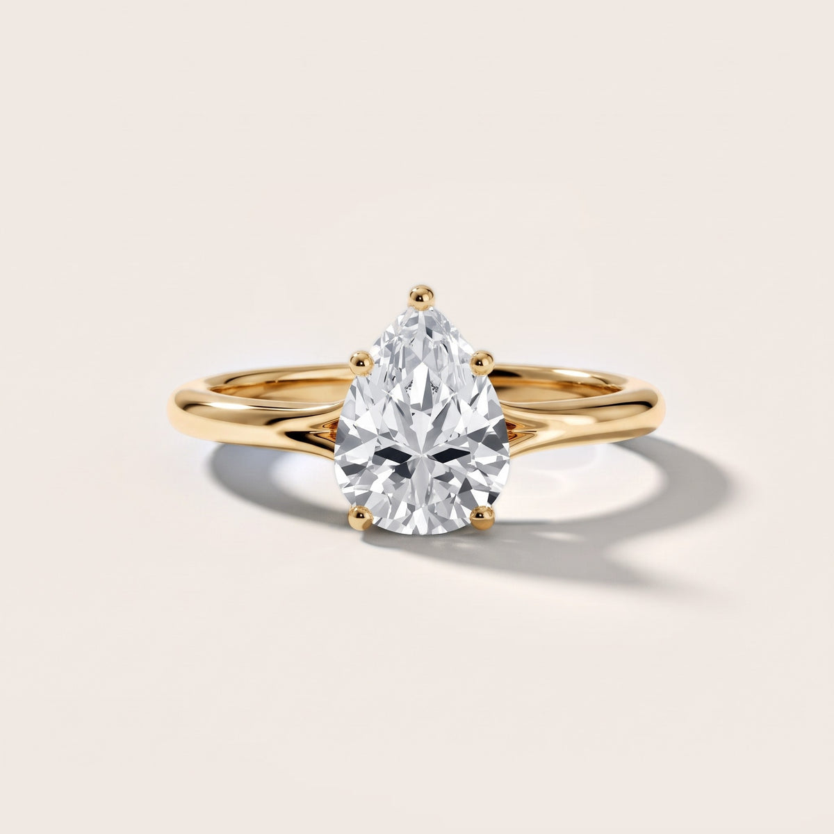 Melanie Solitaire Split Shank Pear Diamond Engagement Ring in Yellow Gold - front.jpg