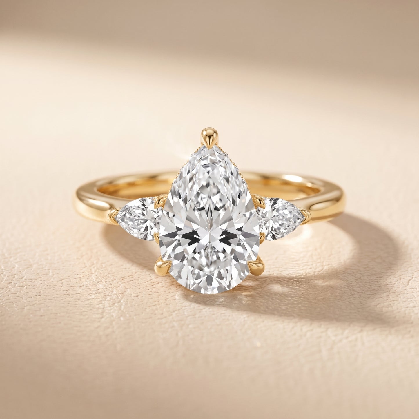 Leila Three-Stone Pear Diamond Engagement Ring in Yellow Gold - front.jpg