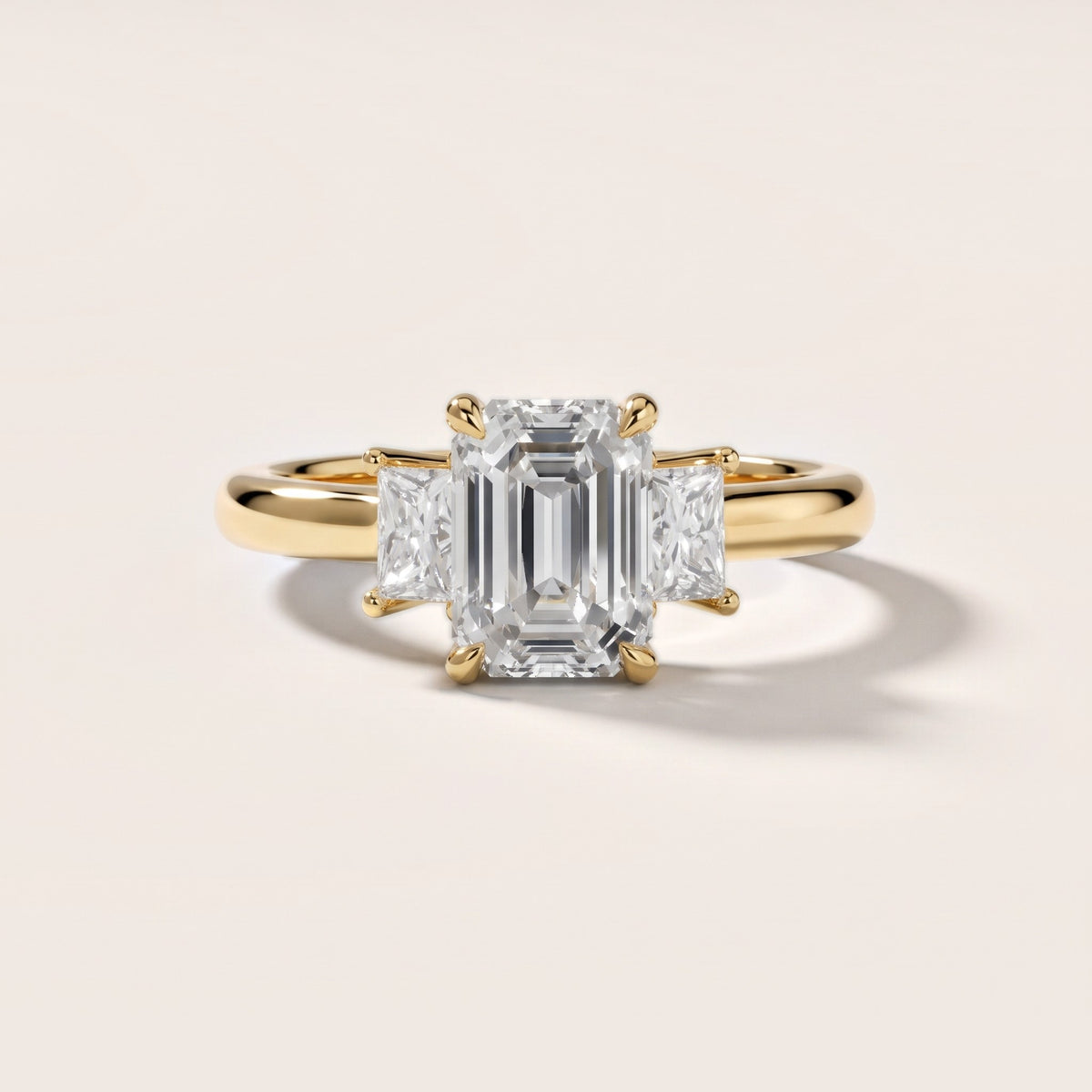 Cosette Statement Three-Stone Emerald Diamond Engagement Ring in Yellow Gold - front.jpg