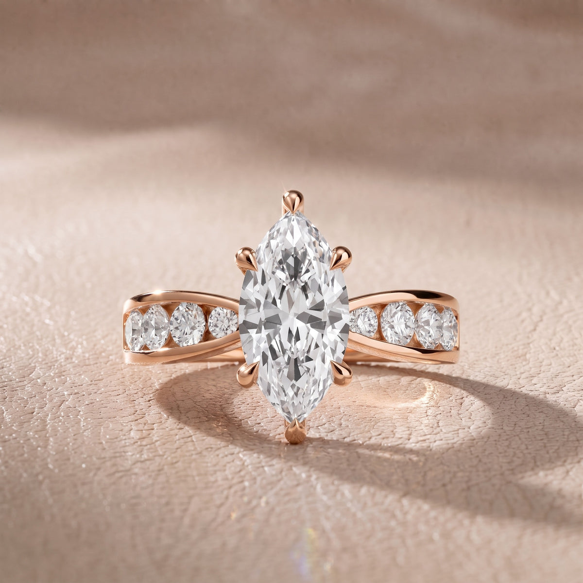 Rosalie Channel Set Sidestone Marquise Diamond Engagement Ring in Rose Gold - front.jpg