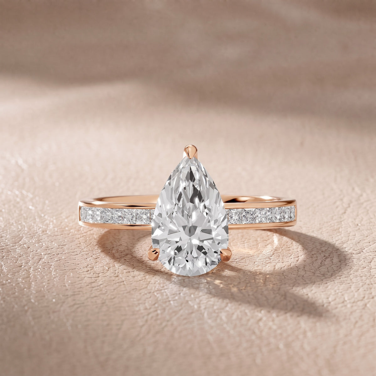 Maren Sidestone Channel Set Pear Diamond Engagement Ring in Rose Gold - front.jpg