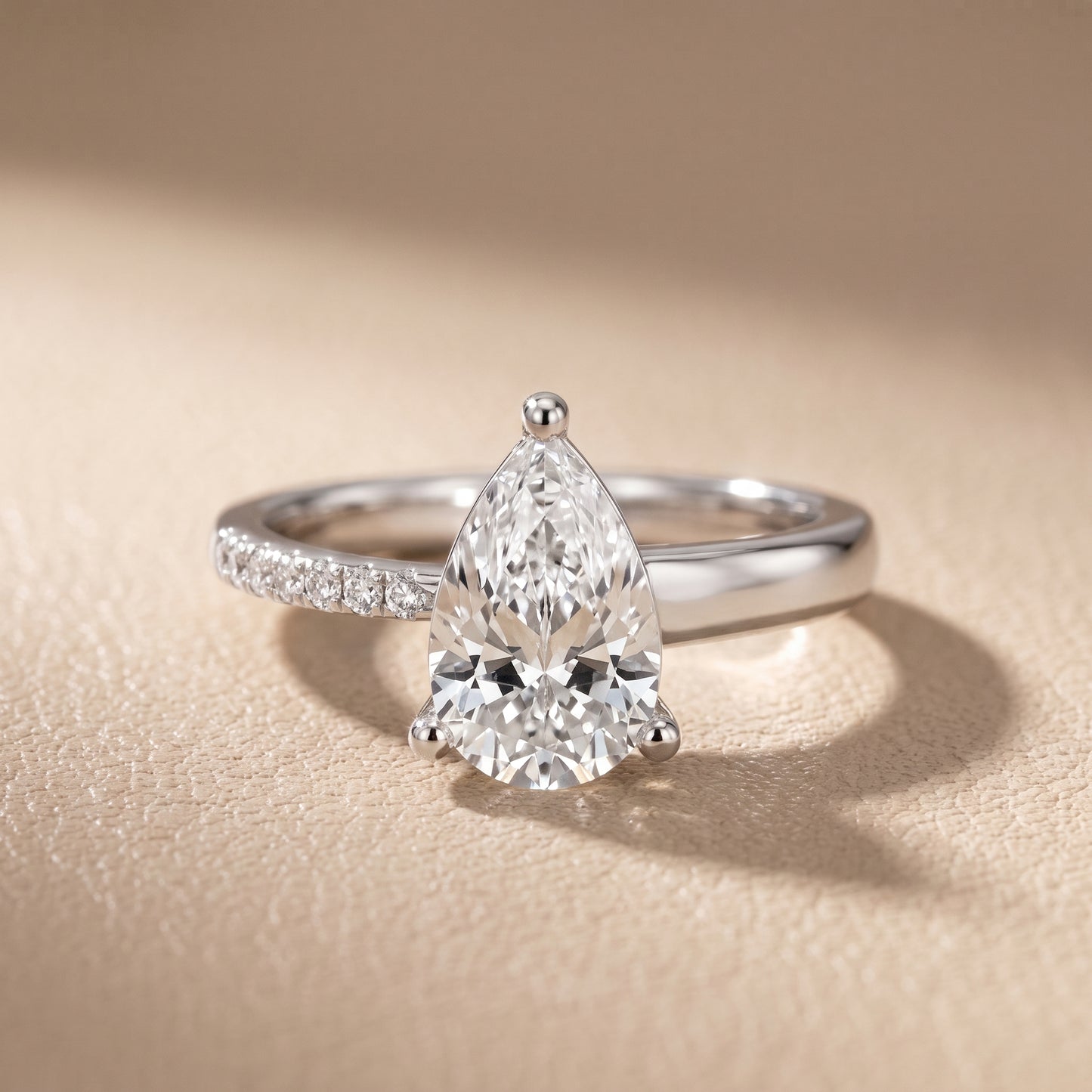 Rosie Solitaire Basket Pear Diamond Engagement Ring in Platinum - front.jpg