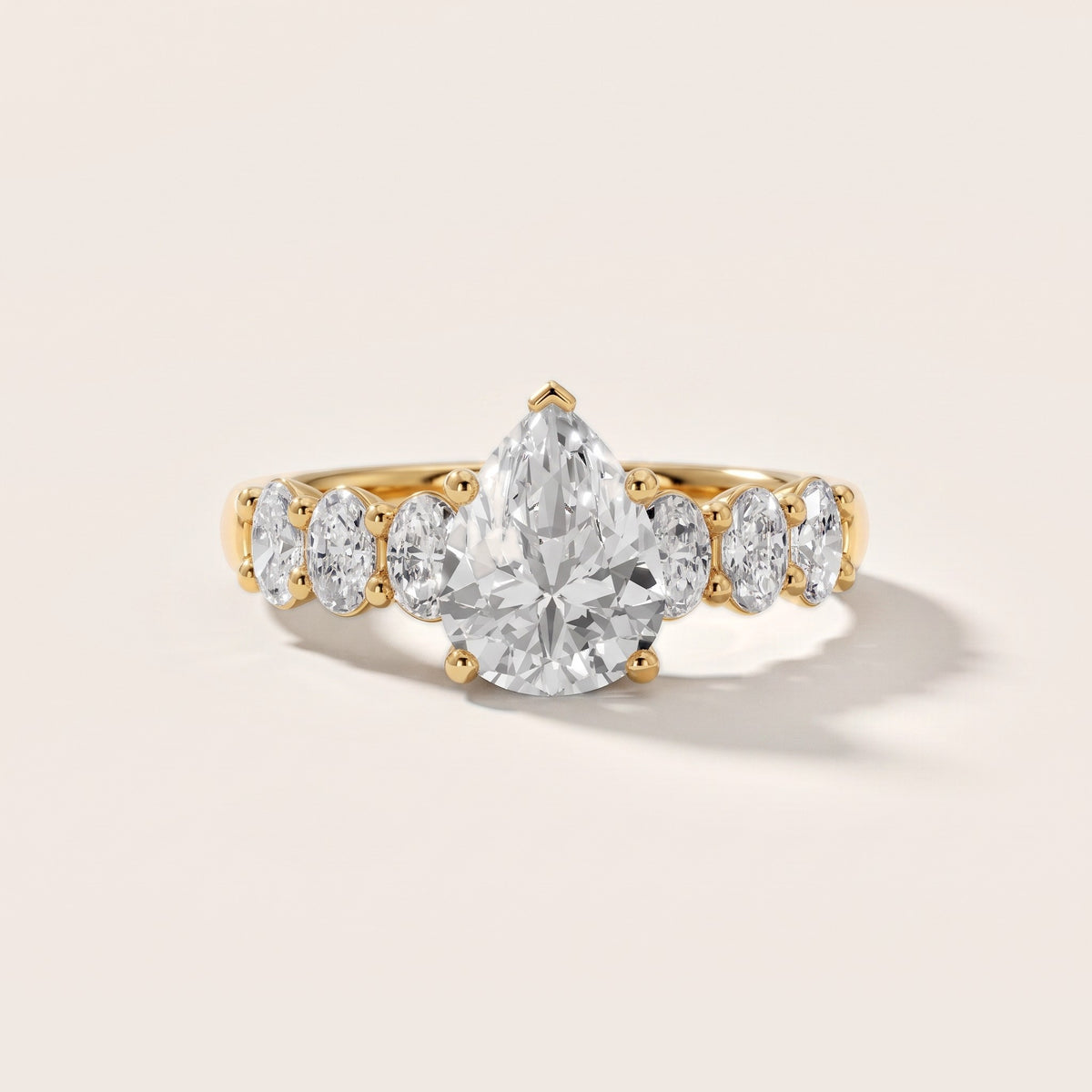 Kiera Graduated Seven-Stone Pear Diamond Engagement Ring in Yellow Gold - front.jpg